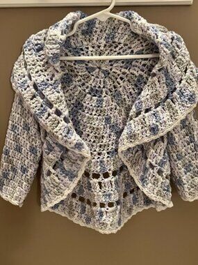 Sassy little shrug. Handmade by Mom. Fits most children aged 7-10 years.